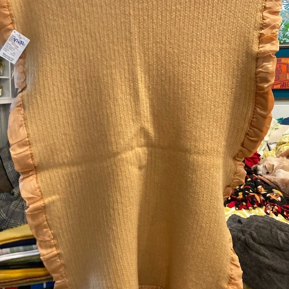 Vintage 1960’s lap blanket. Feels like wool with satin edging. 47”‎ x 32”. 151
